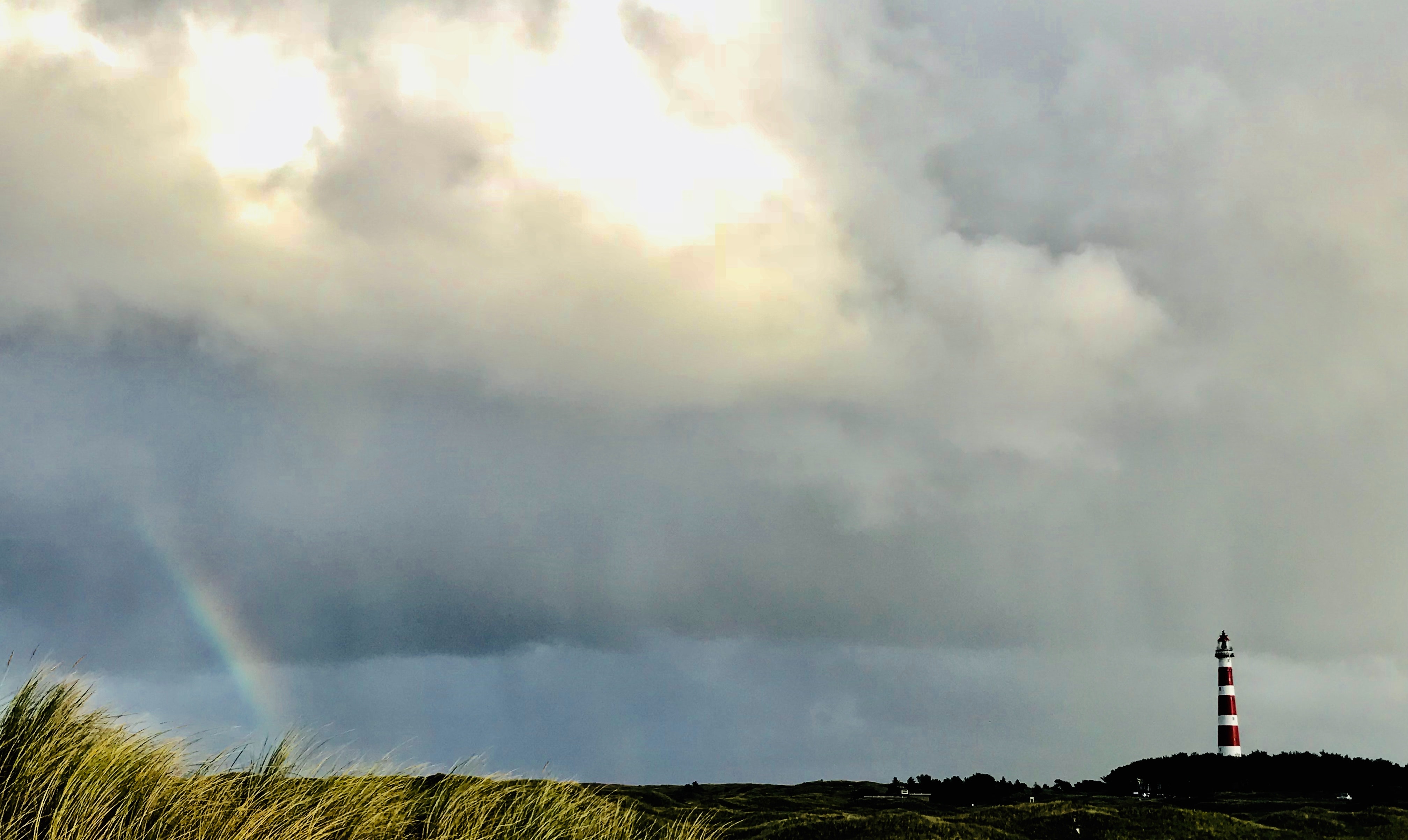 Rainbow and lighthouse