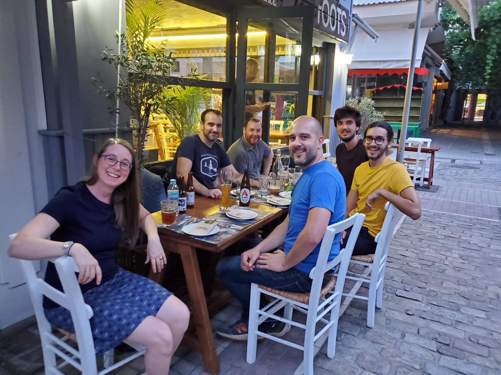 Heather, Adrien, Bob, François, Tobias and Julian sitting outside a restaurant