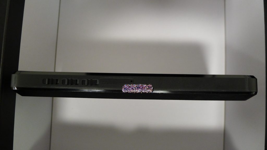 The left side of the Librem 5 USA painted with purple glitter nail polish for anti-interdiction