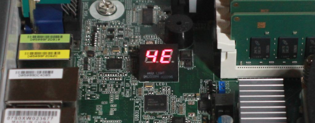 Photo of Librem L1UM v2 mainboard, showing dual seven-segment display between memory slots and I/O panel