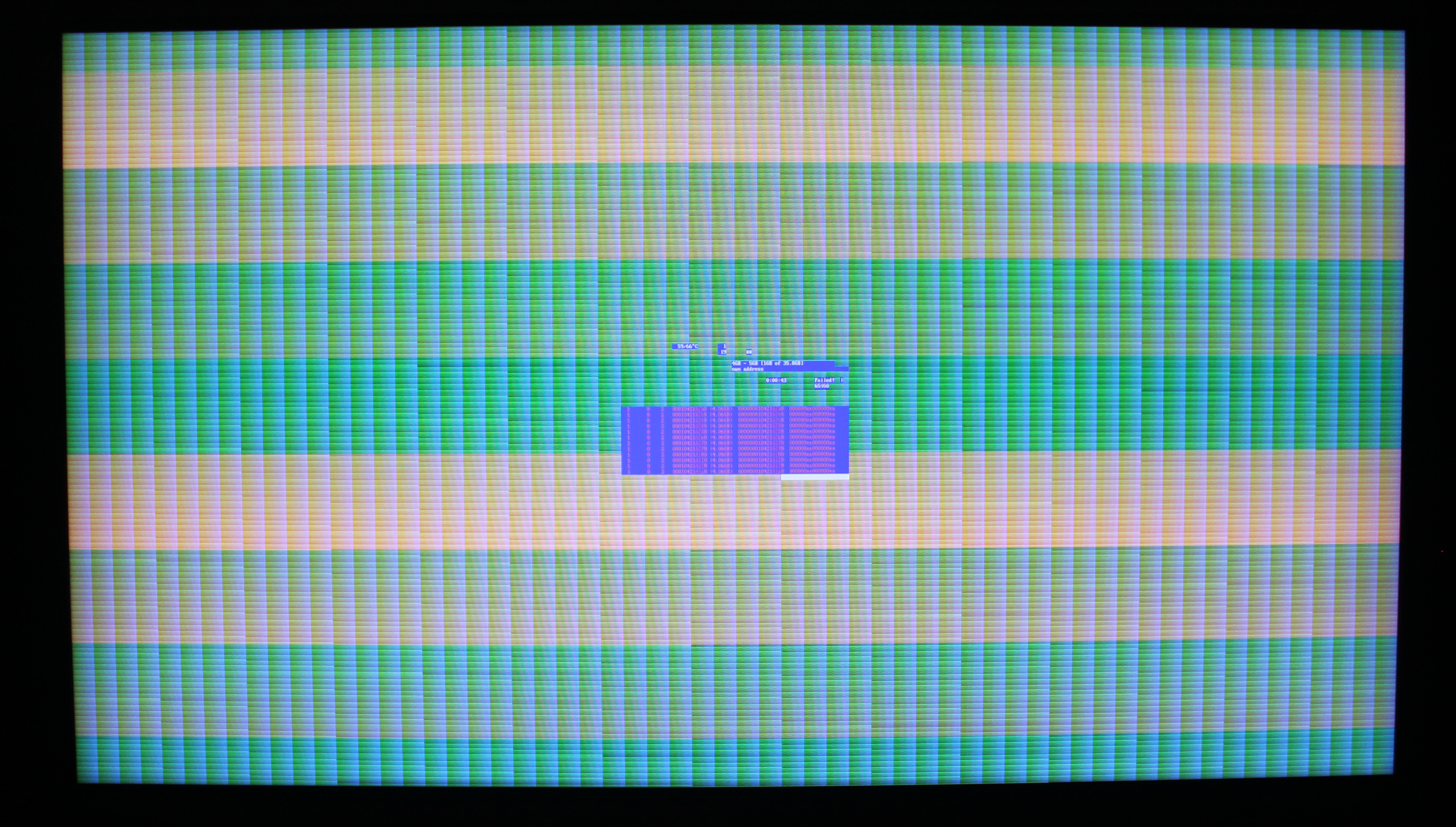 Photo of 4K TV showing stripe patterns with partial memtest86+ output.