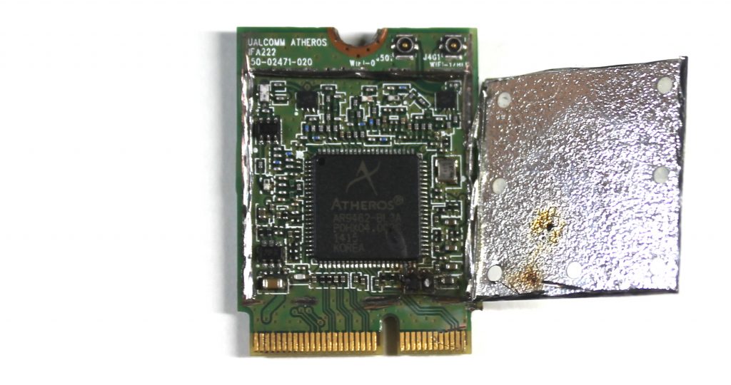 Atheros Wi-Fi card, with the EMI shield cut off, internals exposed