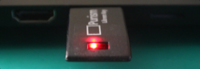 Photo of Librem Key inserted to Librem 14, with red LED lit